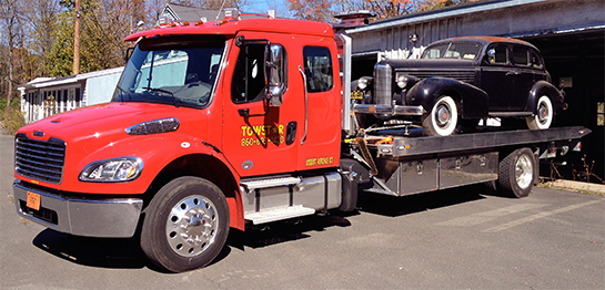 Flatbed hauling antique cars in Connecicut