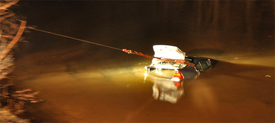 Recovering vehicle from water using tow truck in CT